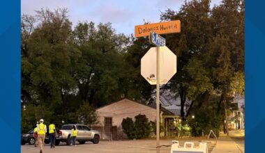 Cesar Chavez Boulevard sign briefly covered with cardboard bearing Dolores Huerta's name in Southtown