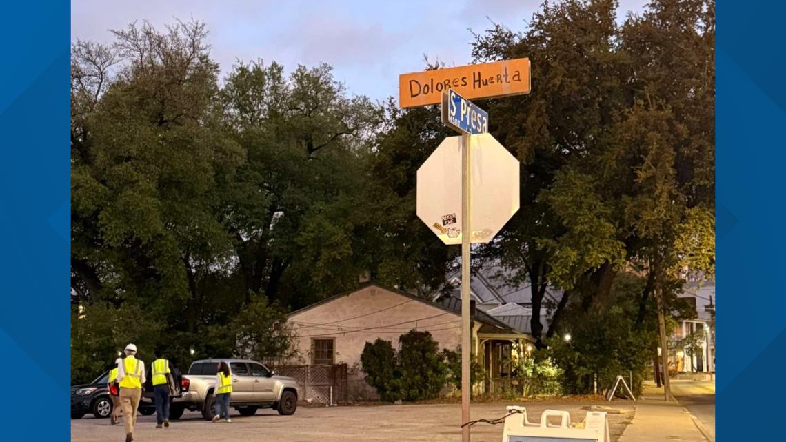 Cesar Chavez Boulevard sign briefly covered with cardboard bearing Dolores Huerta's name in Southtown