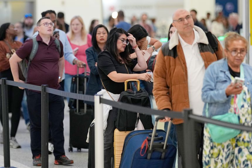 Travelers languished in a security line Wednesday at George Bush Intercontinental Airport.