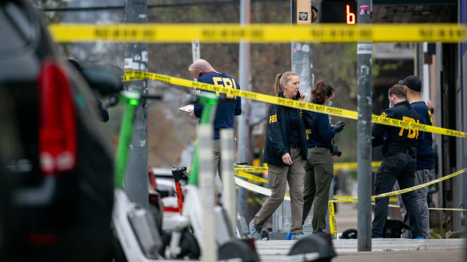FBI agents investigate at the scene of a mass shooting in downtown Austin, Texas, on Sunday. - Brandon Bell/Getty Images