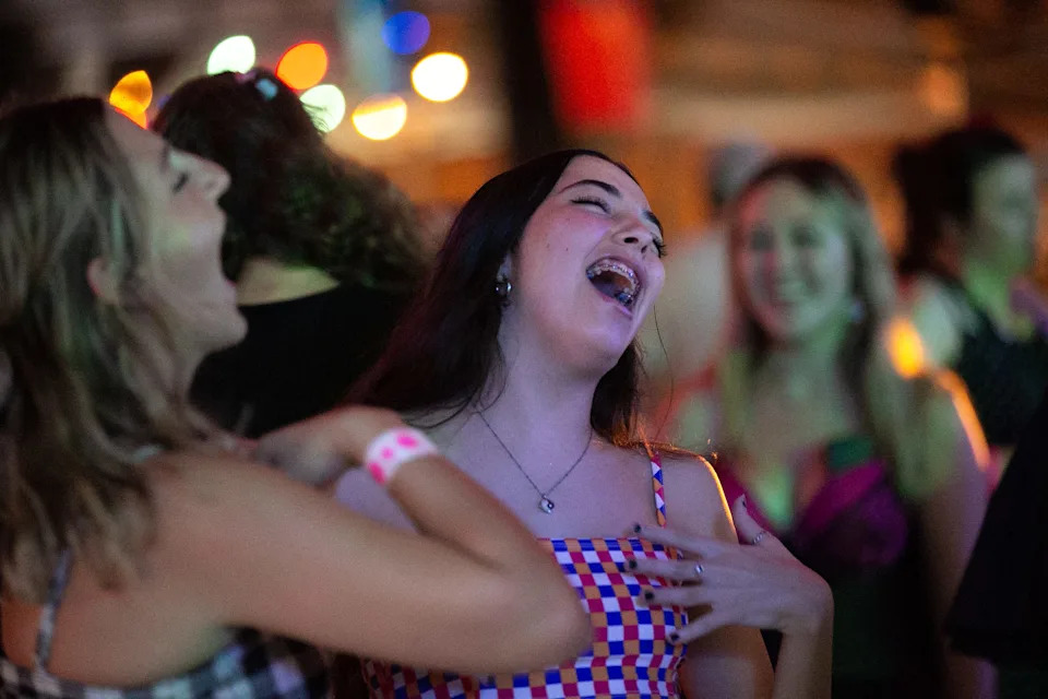 Attendees sing to the music of Taylor Swift and Olivia Rodrigo during a Swift & Sour Dance Party at Brewster Street in downtown Corpus Christi on Sept. 9, 2022.