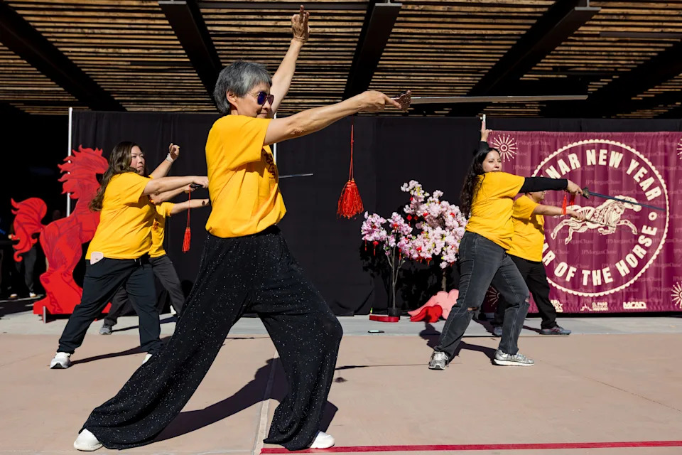 Shinping “Champagne” Chyi, principal of the Ai-Hwa Chinese Language School, performs tai chi sword with her students at Cleveland Square Park during El Paso’s Lunar New Year celebration on Saturday, Feb. 28, 2026, in El Paso.