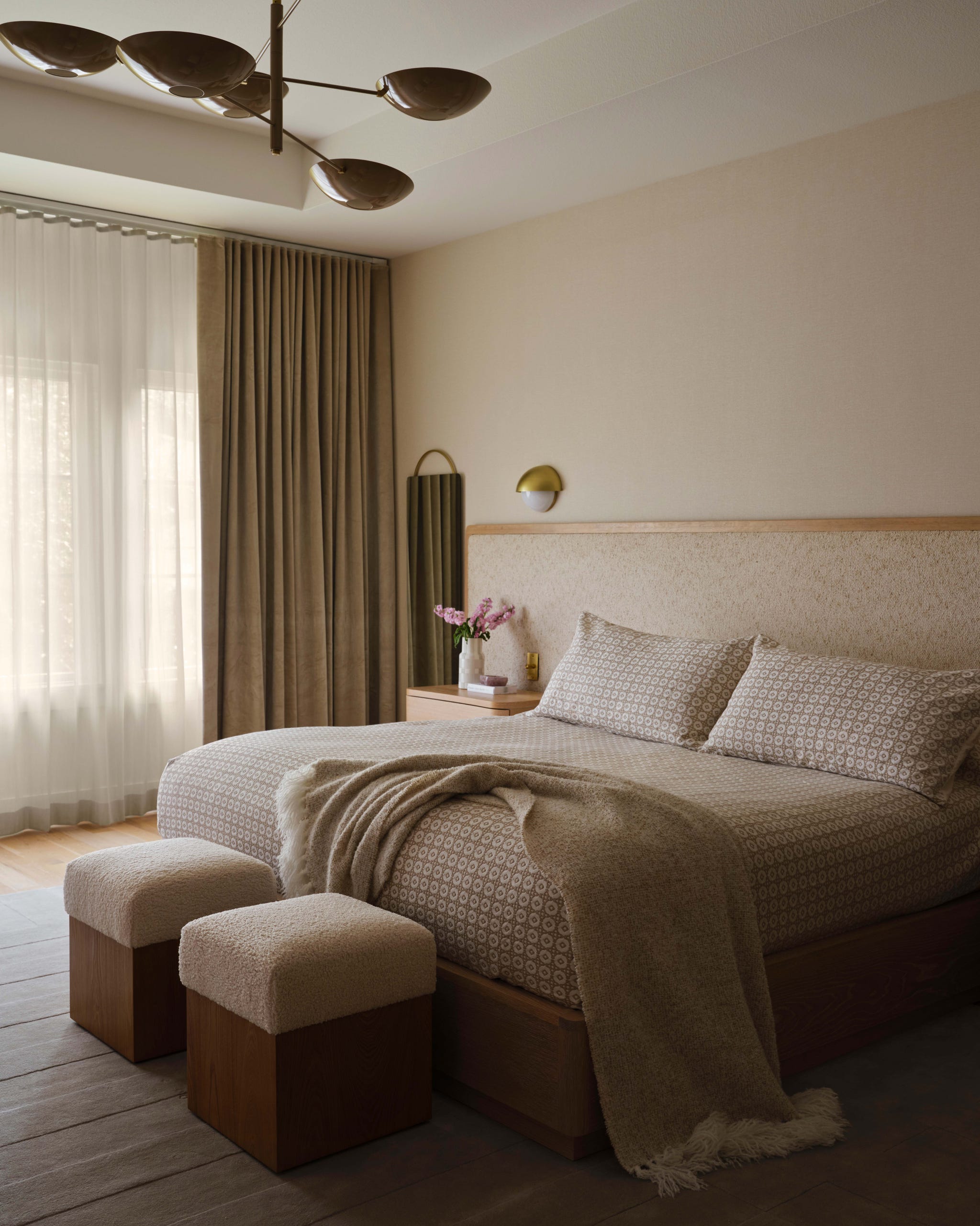 Modern bedroom featuring a bed, decor, and lighting.