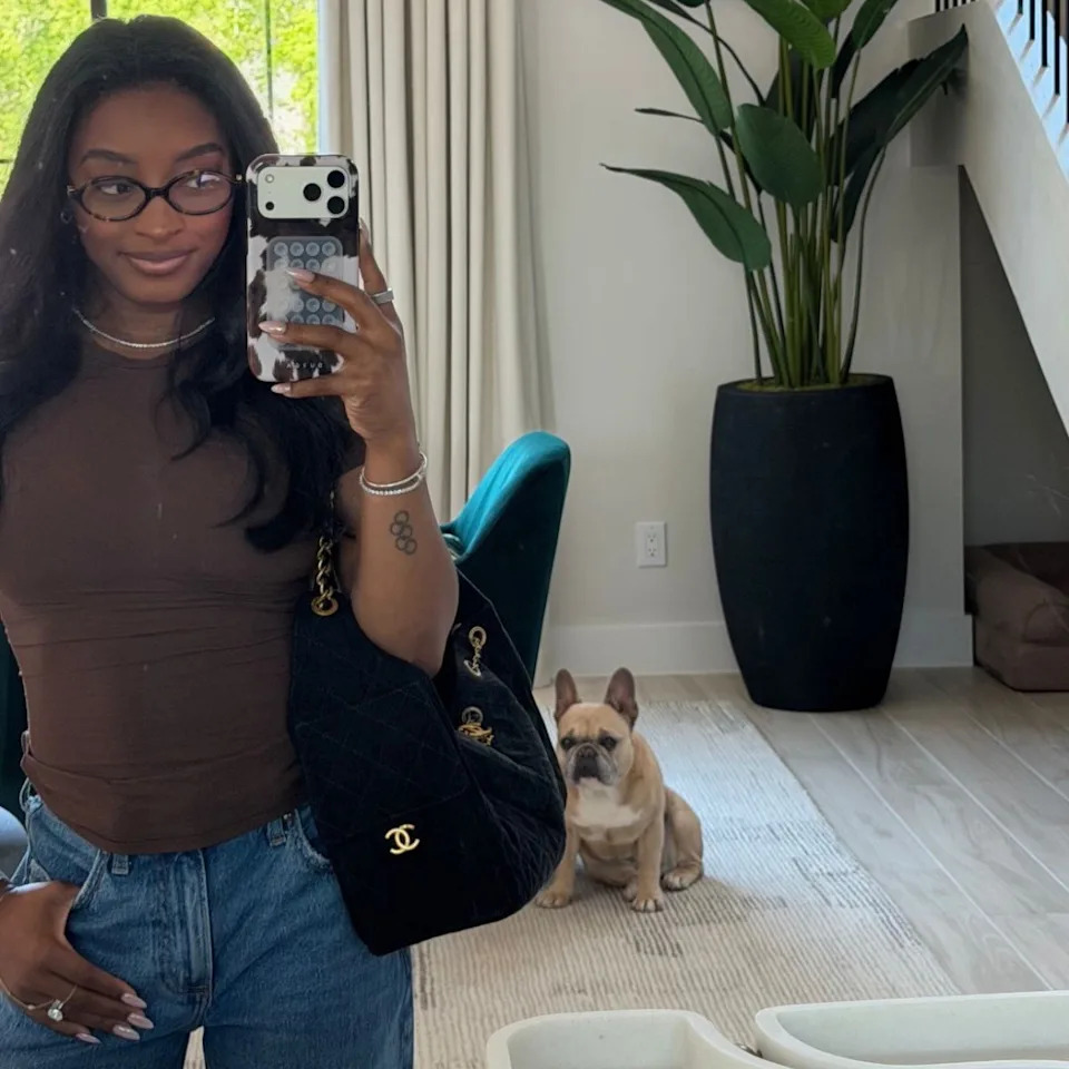 Simone Biles poses for a photo inside her Texas home