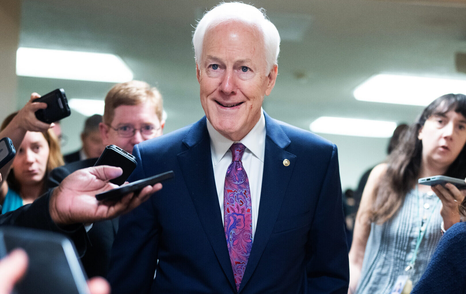 Sen. John Cornyn, R-Texas, talks with reporters in the U.S. Capitol during votes on Tuesday, March 10, 2026.