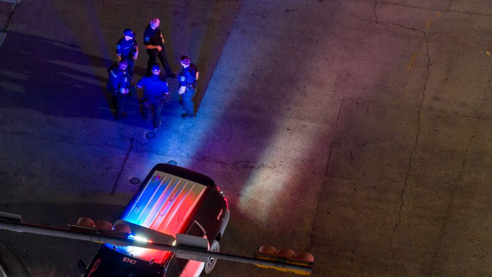 In an aerial view, law enforcement patrol an intersection near Buford's bar on Sunday in Austin, Texas. - Brandon Bell/Getty Images