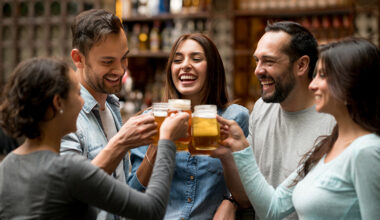 Happy group of friends making a toast at a restaurant