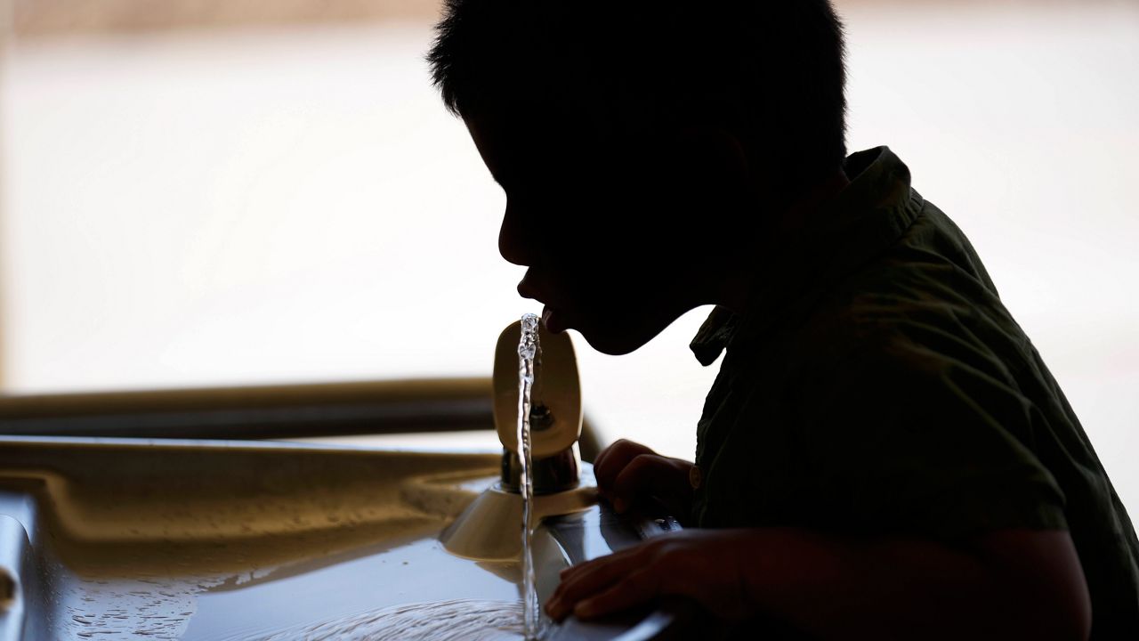 A student drinks from a water fountain at an elementary school in California, Sept. 20, 2023. (AP Photo/Marcio Jose Sanchez, File)