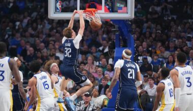 Moses Moody of the Warriors is carted off after apparent knee injury late in OT against Mavs