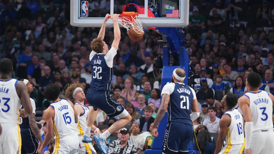 Moses Moody of the Warriors is carted off after apparent knee injury late in OT against Mavs