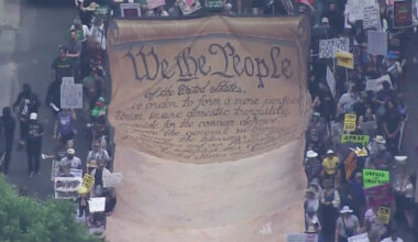 Demonstrators gather, then march in downtown Houston 'No Kings' protest