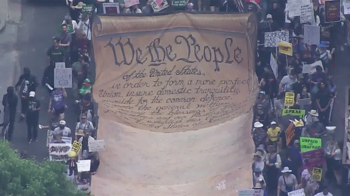 Demonstrators gather, then march in downtown Houston 'No Kings' protest