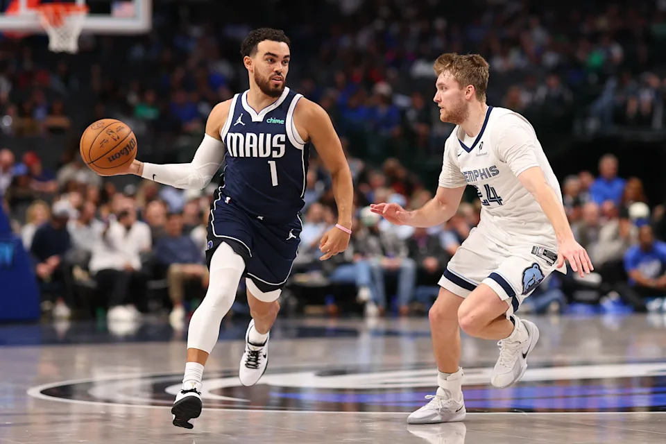 DALLAS, TEXAS - FEBRUARY 27: Tyus Jones #1 of the Dallas Mavericks is defended by Cam Spencer #24 of the Memphis Grizzlies during the fourth quarter at American Airlines Center on February 27, 2026 in Dallas, Texas. NOTE TO USER: User expressly acknowledges and agrees that, by downloading and or using this photograph, user is consenting to the terms and conditions of the Getty Images License Agreement. (Photo by Sam Hodde/Getty Images) | Getty Images