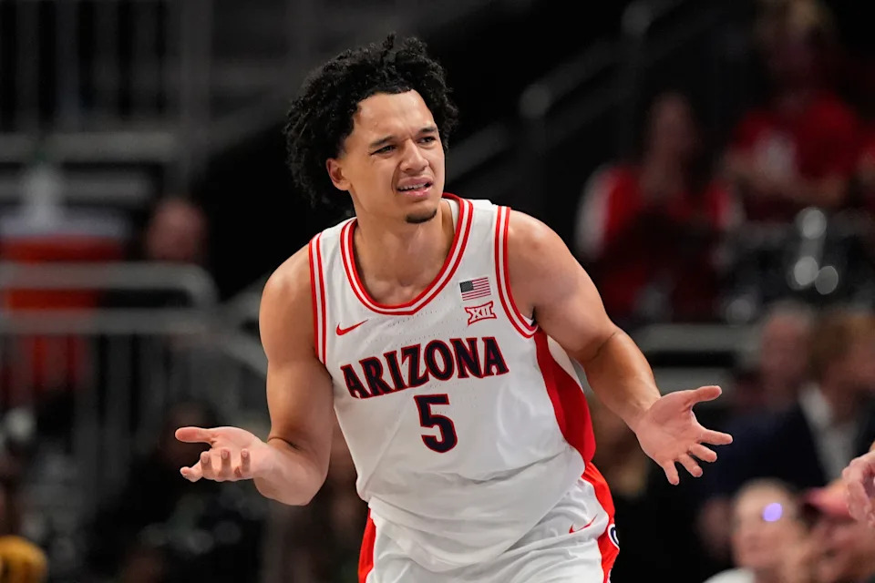 Arizona's Brayden Burries reacts after making a basket during the first half of an NCAA college basketball game against Houston in the championship of the Big 12 Conference tournament Saturday, March 14, 2026, in Kansas City, Mo. (AP Photo/Charlie Riedel)