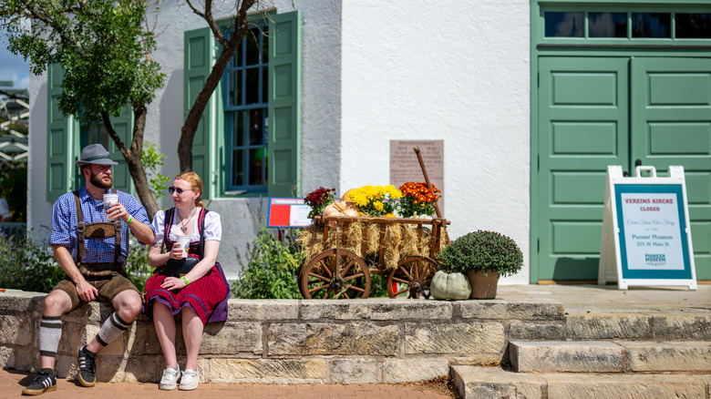 Two people celebrating Oktoberfest in Fredericksburg, Texas