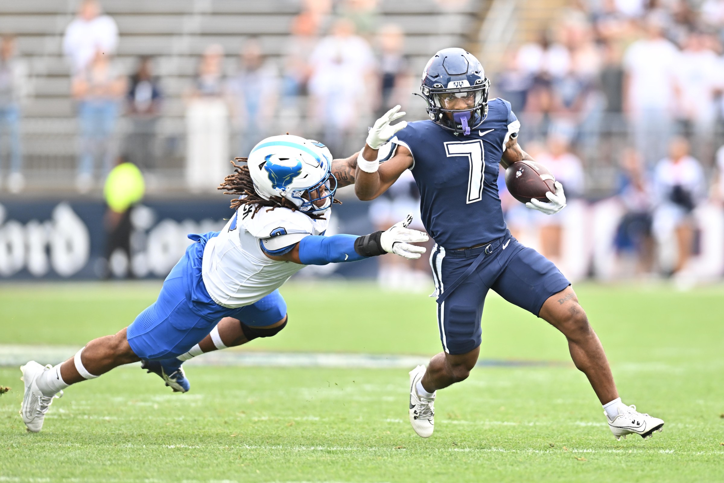 EAST HARTFORD, CT - SEPTEMBER 28: Buffalo Bulls linebacker Red Murdock (2) looks to make the stop as UConn Huskies running back Mel Brown (7) carries the ball during the college football game between the Buffalo Bulls and the UConn Huskies on September 28, 2024, at Pratt & Whitney Stadium in East Hartford, Connecticut. (Photo by Williams Paul/Icon Sportswire via Getty Images)
