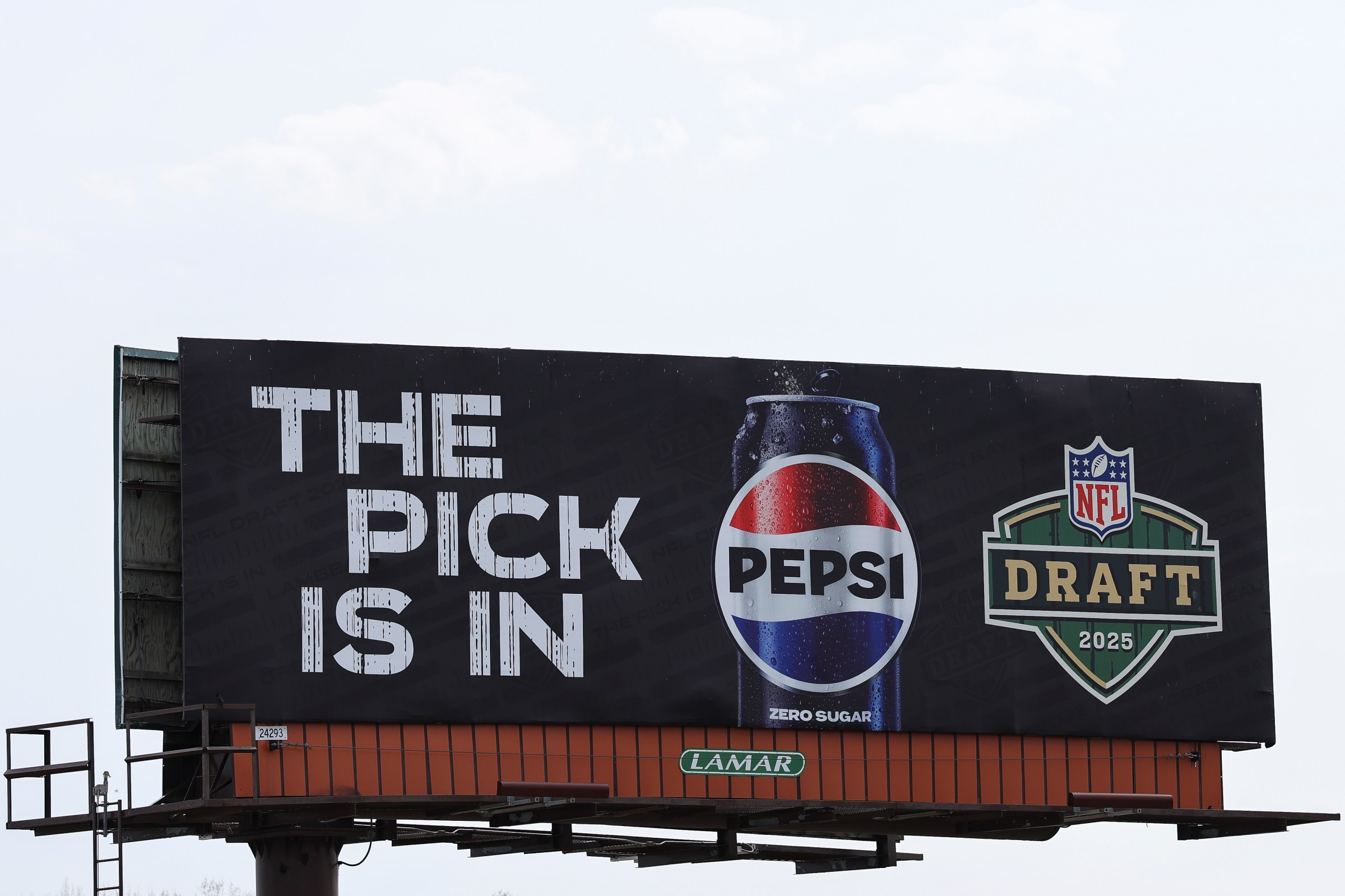GREEN BAY, WISCONSIN - APRIL 24: A Pepsi ad with the slogan The Pick Is In on a billboard ahead of the NFL football draft at Lambeau Field on April 24, 2025 in Green Bay, Wisconsin. (Photo by Aaron M. Sprecher/Getty Images)