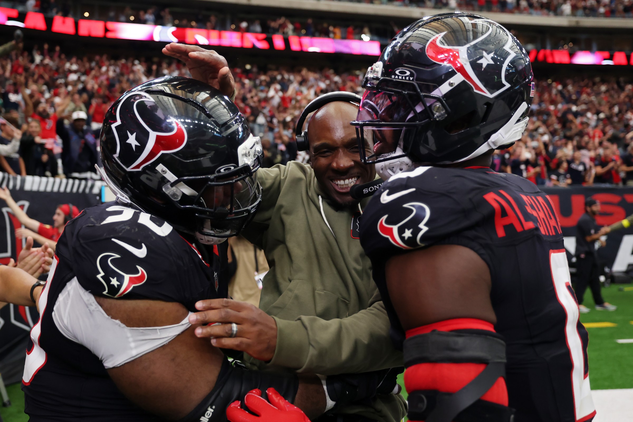 HOUSTON, TEXAS - NOVEMBER 09: Head coach DeMeco Ryans, Sheldon Rankins #90 and Azeez Al-Shaair #0 of the Houston Texans celebrate their 36-29 win against the Jacksonville Jaguars in the game at NRG Stadium on November 09, 2025 in Houston, Texas. (Photo by Tim Warner/Getty Images)