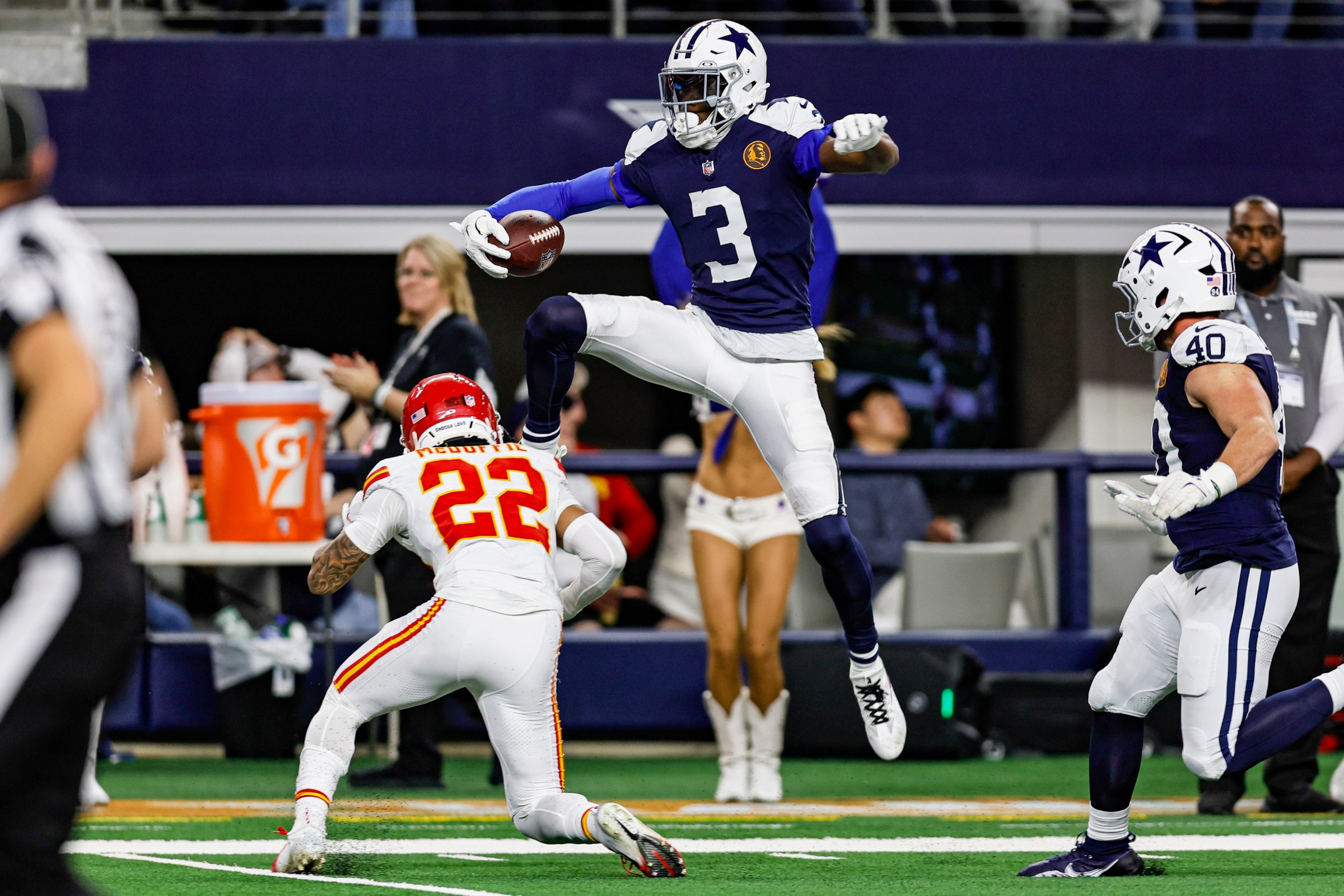 ARLINGTON, TX - NOVEMBER 27: Dallas Cowboys wide receiver George Pickens (3) leaps over Kansas City Chiefs cornerback Trent McDuffie (22)