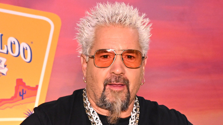 Guy Fieri smirking
