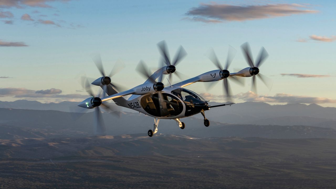 In this 2022 photo provided by Joby Aviation is Joby’s pre-production prototype aircraft in flight above the company’s facilities in Marina, Calif. (Eric Adams/Joby Aviation via AP)