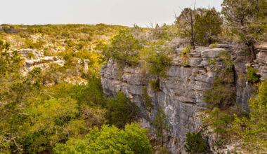 Texas' Gorgeous State Park Northwest Of Austin Is A Rustic Haven With Caves And A Stunning Waterfall