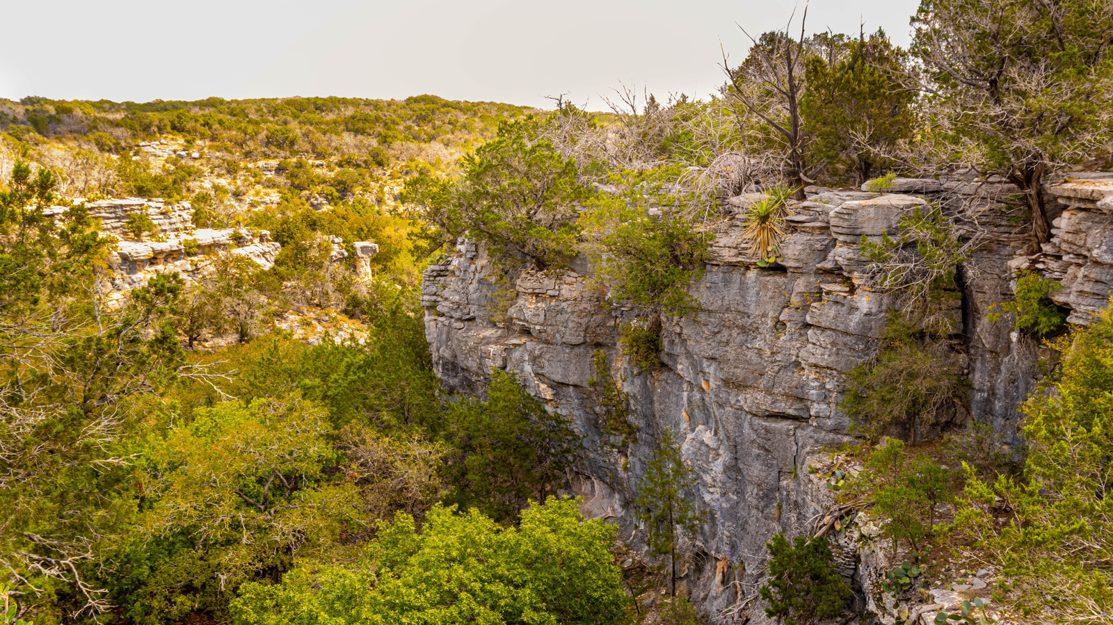 Texas' Gorgeous State Park Northwest Of Austin Is A Rustic Haven With Caves And A Stunning Waterfall