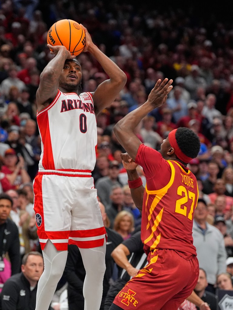 Jaden Bradley of Arizona shoots a game-winning basket over Killyan Toure of Iowa State.