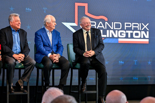 FILE -Texas Rangers chief operating officer Neil Leibman, left, Penske corporation chairman Roger Penske, center, and Dallas Cowboys team owner Jerry Jones, right, attend a news conference in Arlington, Texas, Tuesday, Oct. 8, 2024, announcing the IndyCar Grand Prix of Arlington to be held in 2026. (AP Photo/Jerome Miron, File)