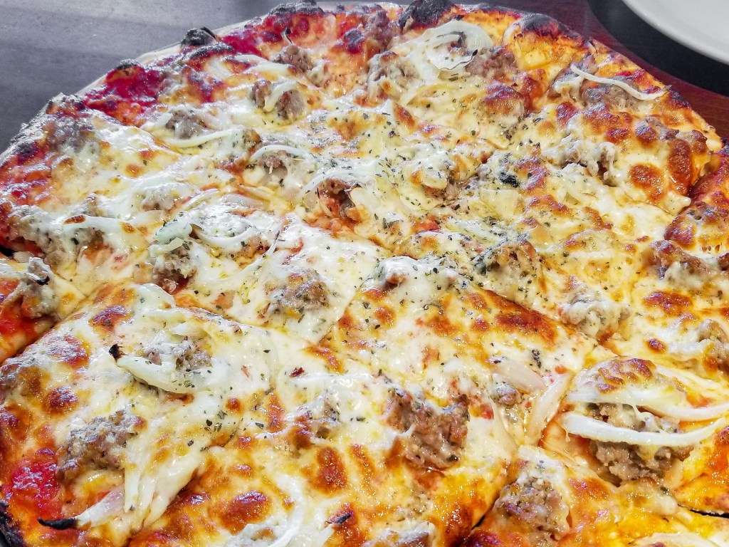 Thin crust tavern-style Italian sausage and onions on Rosati's version of Chicago tavern-style thin crust pizza.