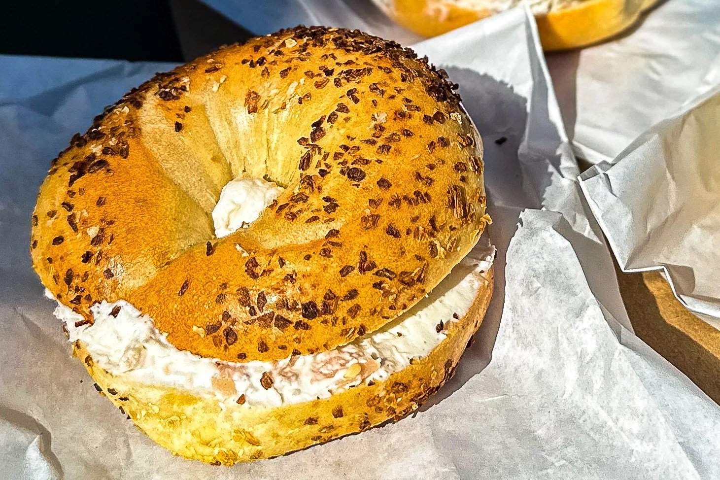 A toasted onion bagel with lox schmear from Starship Bagels, the reigning king of Dallas bageldom.