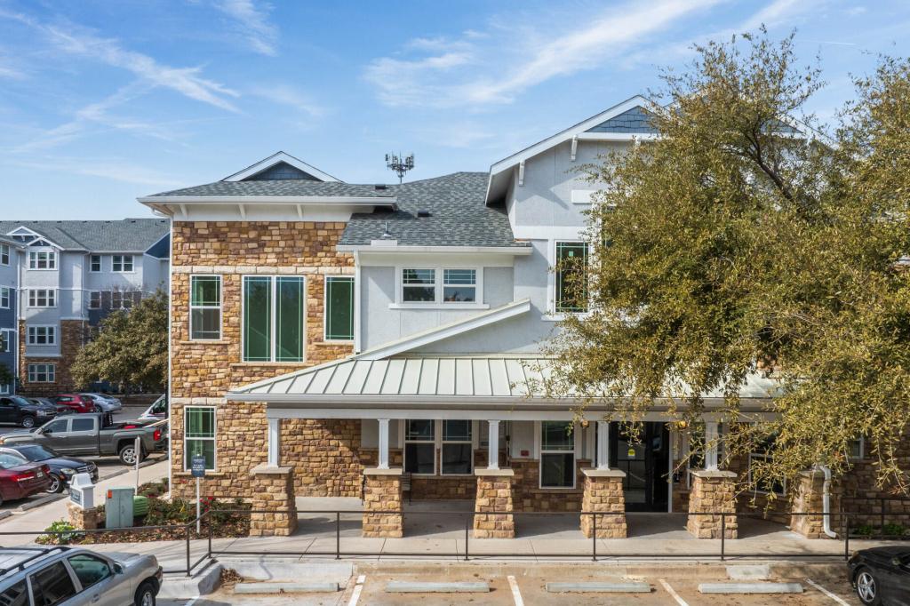 Left image shows a two-story building that houses the management offices for Sunday Village. The building exterior features brown stone and light grey vinyl siding.