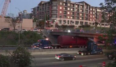 Truck gets wedged under overpass in downtown Austin