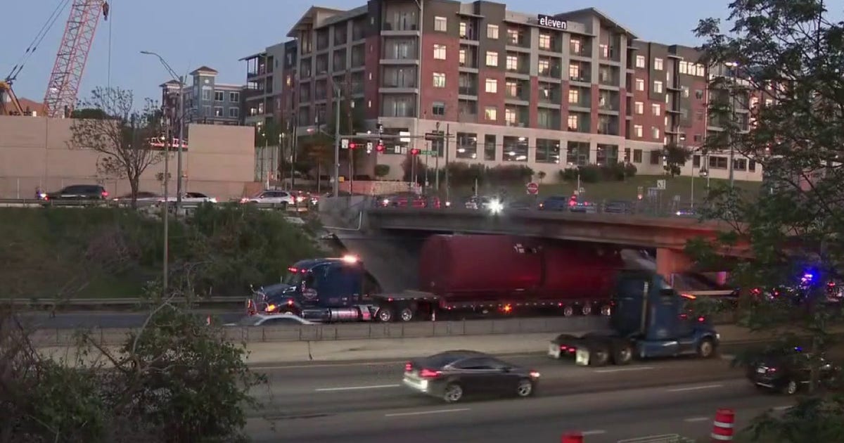 Truck gets wedged under overpass in downtown Austin