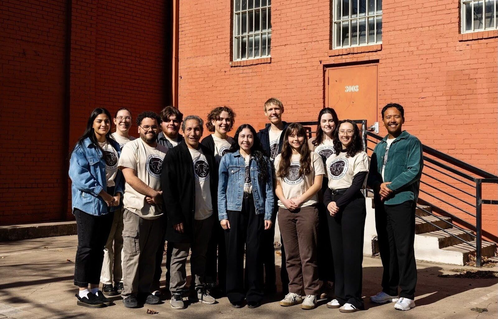 Workers at the Fort Worth Report posing for a photo after they announced their plans to unionize.