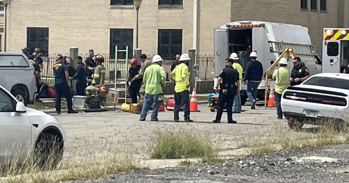 Crews working to pull worker trapped in manhole in Downtown Corpus Christi