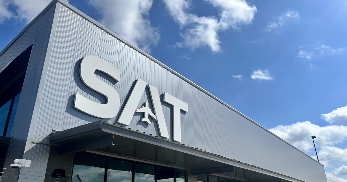 Airport officials and San Antonio city leaders celebrate the opening of SAT’s Terminal A ground expansion