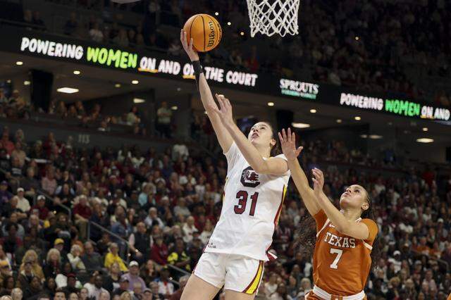 South Carolina's Alicia Tournebize (31) shoots as Texas’s Jordan Lee (7) defends during the first half of action of their women's basketball game in the SEC Tournament, against Texas at the Bon Secours Wellness Arena on Sunday, March 8, 2026.