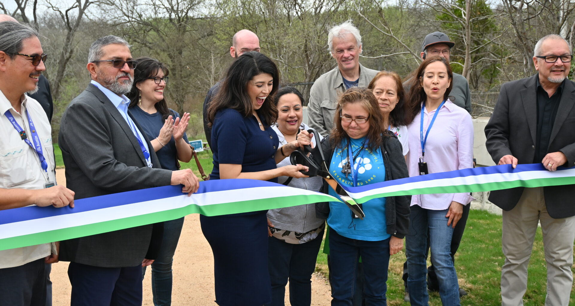 Council Member Fuentes, City of Austin Officials and community members ceremonially cut a ribbon at the greenbelt entrance.