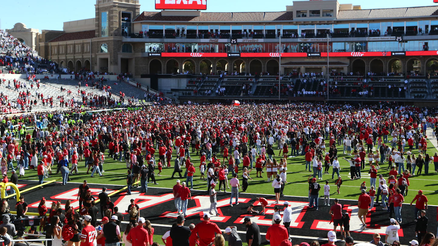 Nov 8, 2025; Lubbock, Texas, USA;  Fans fill the field after the game between the Texas Tech Red Raiders and the Brigham Young Cougars at Jones AT&T Stadium. Mandatory Credit: Michael C. Johnson-Imagn Images