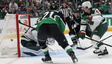 Apr 18, 2026; Dallas, Texas, USA;Dallas Stars left wing Jason Robertson (21) scores on a back hand goal against Minnesota Wild goaltender Jesper Wallstedt (30)  in the second period in game one of the first round of the 2026 Stanley Cup Playoffs at American Airlines Center. Mandatory Credit: Thomas Shea-Imagn Images