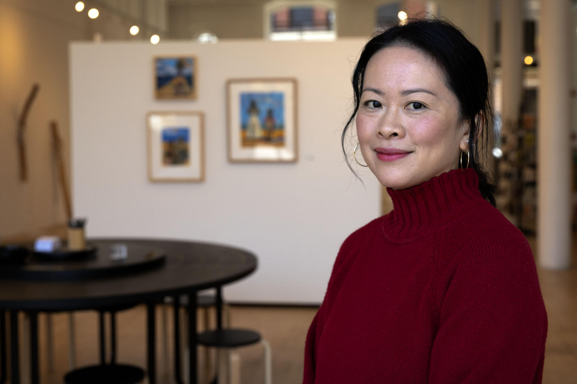 Yng-Ru Chen, founder of the Praise Shadows Art Gallery on Kingston Street in Boston, Mass. (Robin Lubbock/WBUR)
