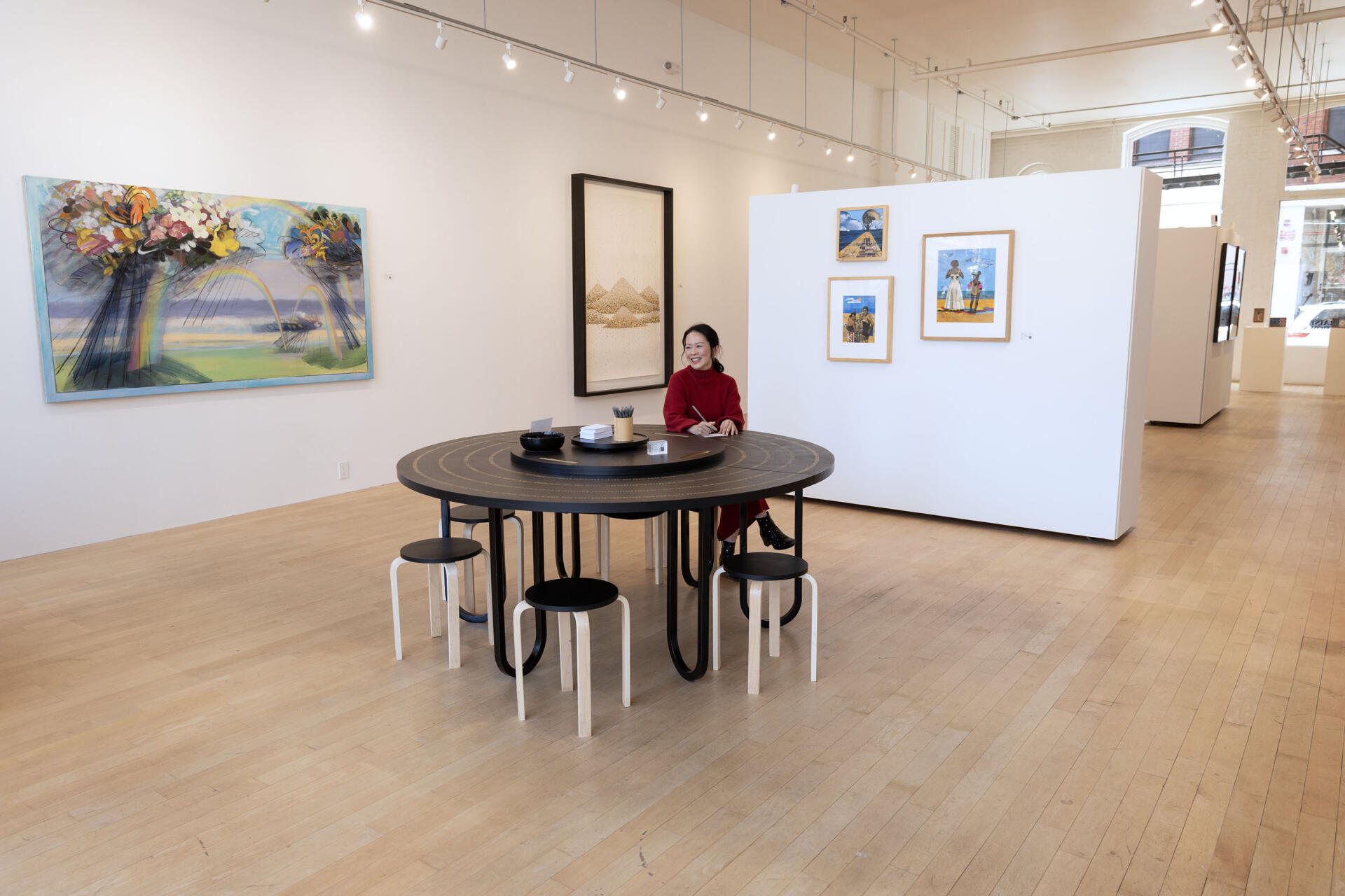 Gallery founder Yng-Ru Chen at the Praise Shadows Art Gallery on Kingston Street in Boston. (Robin Lubbock/WBUR)