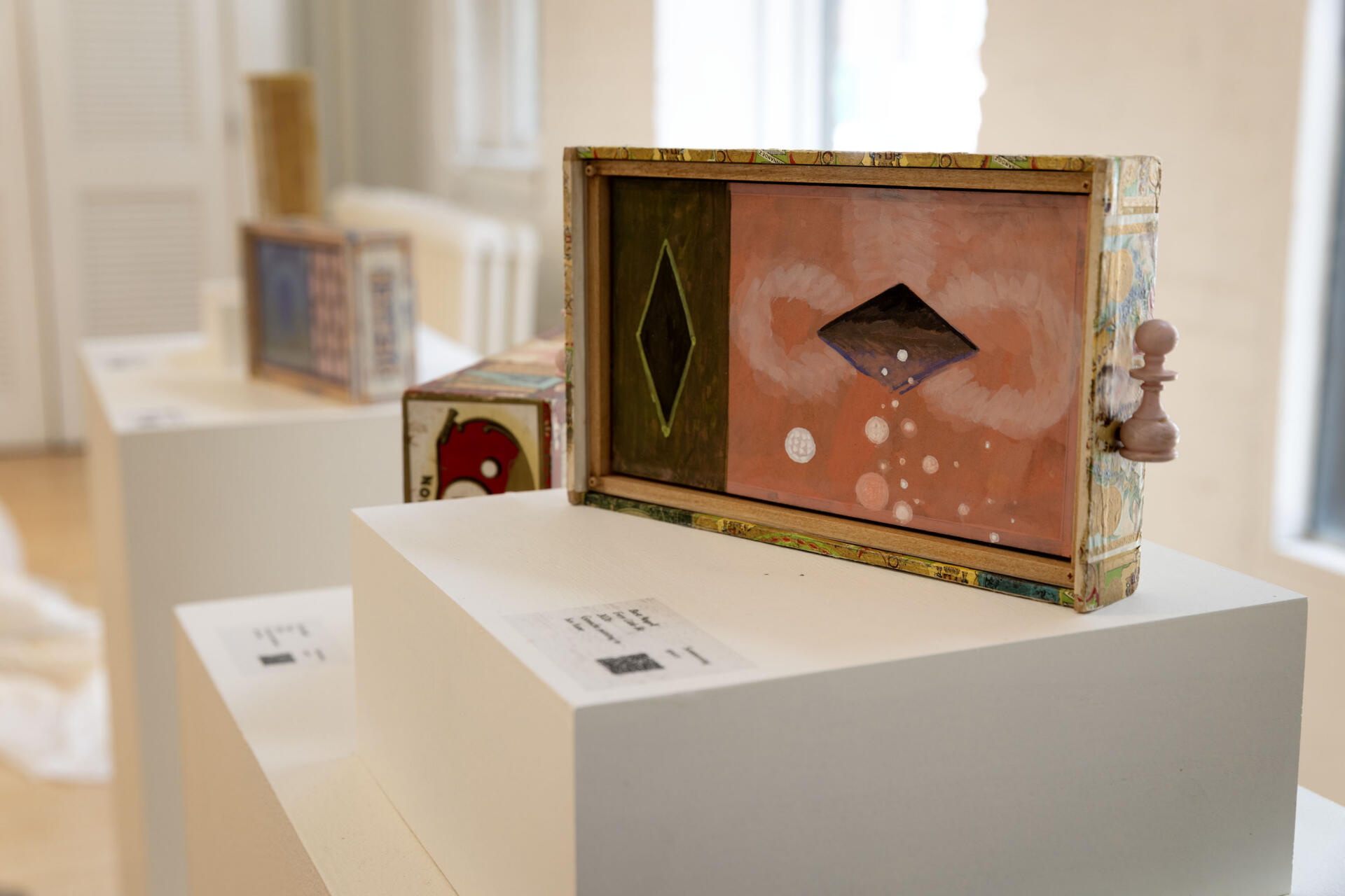 "Every Little Bit," a box frame painting by Brett Angell, at the Praise Shadows Art Gallery on Kingston Street in Boston. (Robin Lubbock/WBUR)