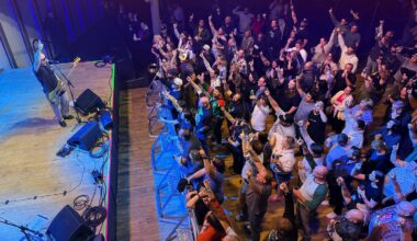 A crowd of fans raise their arms as Eve 6 performs in Dallas.