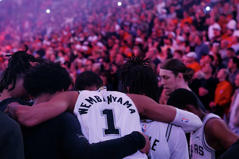 San Antonio Spurs forward Victor Wembanyama (1) huddles with his teammates before the start of Game 4 of a first-round NBA playoff series against the Portland Trail Blazers at Moda Center on Sunday, April 26, 2026. (Sam Owens/San Antonio Express-News)