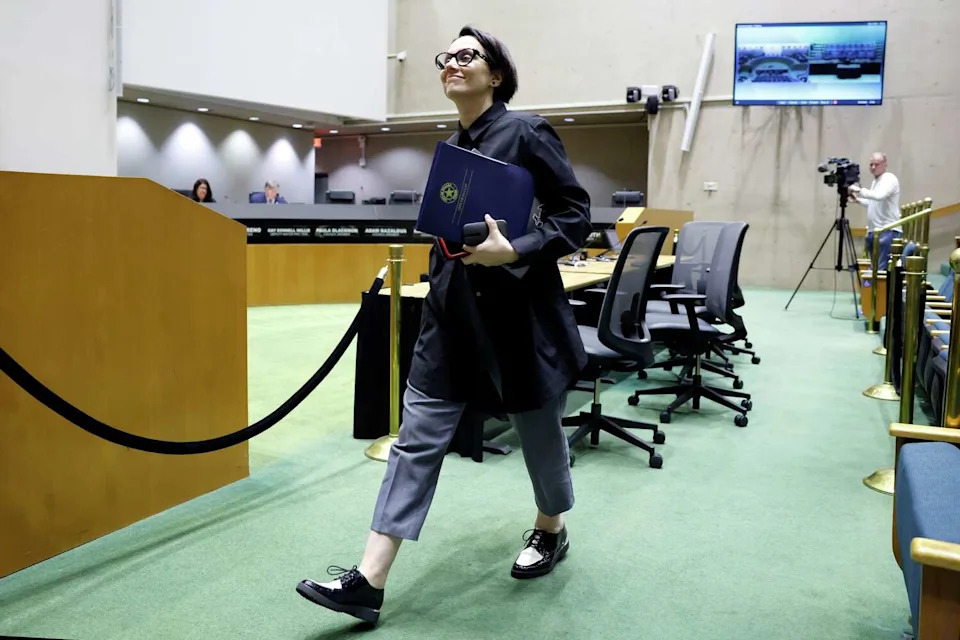 Planning and Development Deputy Director Andreea Udrea finishes answering questions from the Economic Development Committee during a hearing about whether or not to spend consulting money to buy out a pair of shingle manufacturers. The committee heard a consideration of a resolution directing the city manager to utilize contingency reserve funds to procure a consultant for GAF and Tamko shingle manufacturers to shut down during a meeting at Dallas City Hall, April 6, 2026. (Tom Fox/The Dallas Morning News)