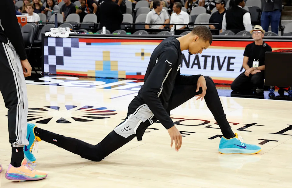 SAN ANTONIO, TX - APRIL 6: Victor Wembanyama #1 of the San Antonio Spurs stretches before the start of their game against the Philadelphia 76ers at Frost Bank Center on April 6, 2026 in San Antonio, Texas. NOTE TO USER: User expressly acknowledges and agrees that, by downloading and or using this photograph, User is consenting to terms and conditions of the Getty Images License Agreement. (Photo by Ronald Cortes/Getty Images)