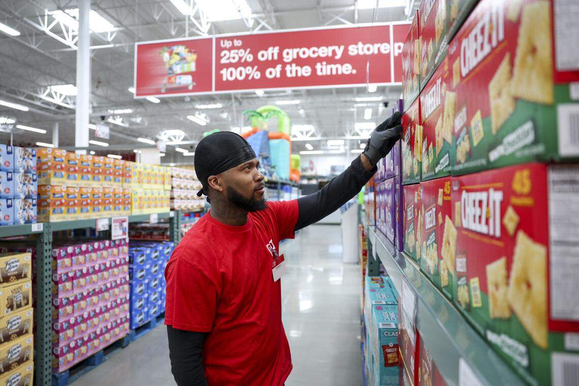 Overnight stocker Rashad Hornsby straightens snacks as BJ’s Wholesale Club prepares for its spring 2026 opening in Fort Worth at 7241 Harris Parkway.