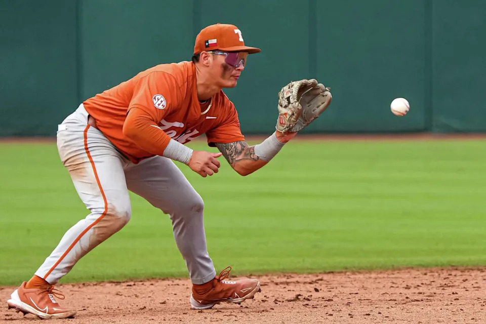 Texas Longhorns infielder Ethan Mendoza (5) catches a ball during the Lone Star Showdown against Texas A&M at Blue Bell Park on Saturday, April 11, 2026 in College Station, Texas. (Aaron E. Martinez/Austin American-Statesman)